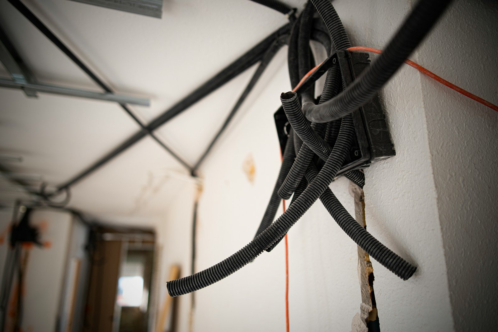 a bunch of wires that are connected to a wall