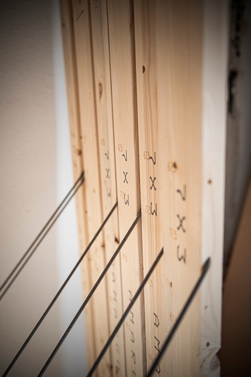 a close up of a wooden wall with writing on it